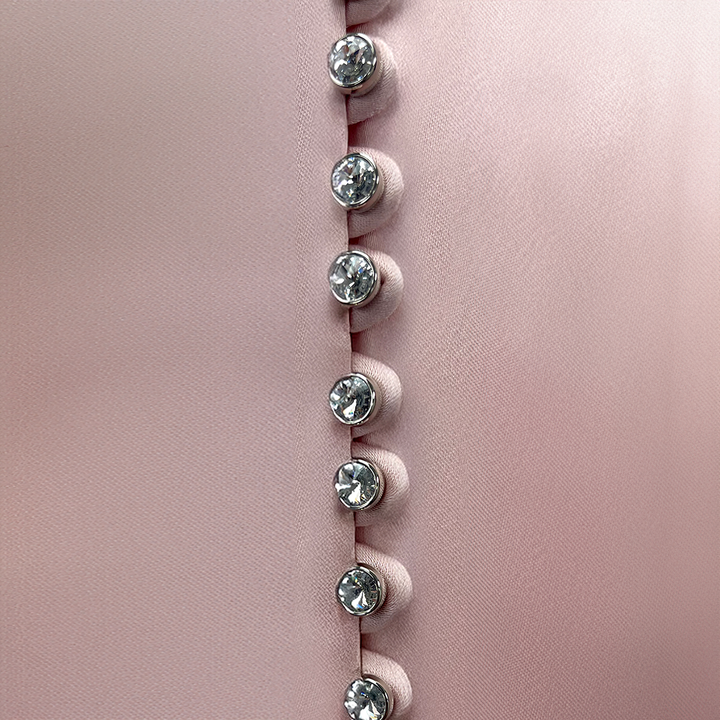 Detail of SemSem Kaftan with Fringe Detail and Crystal Buttons.
