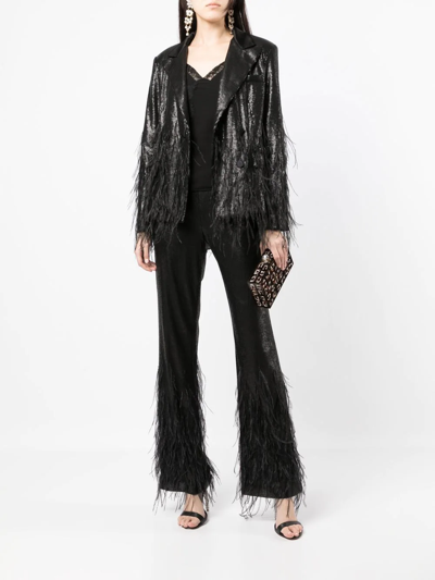 Model Wears SemSem Black Sequin Feather Pants.