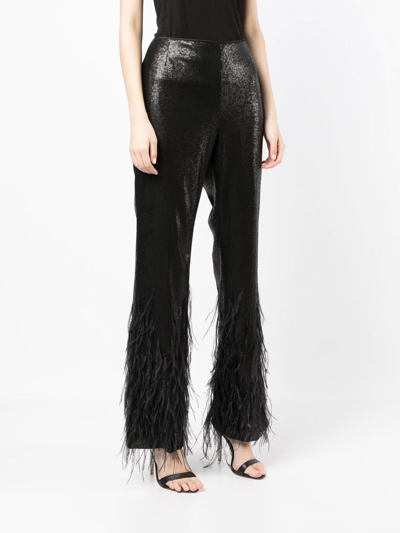 Model Wears SemSem Black Sequin Feather Pants.
