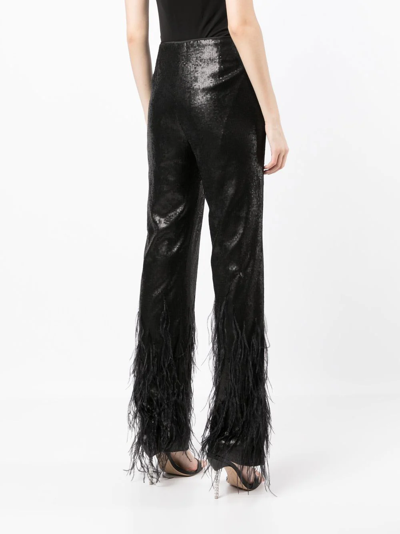 Model Wears SemSem Black Sequin Feather Pants.