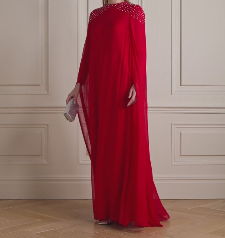 Model Wears Cape-Effect Crystal-Embellished Silk-Chiffon Gown.